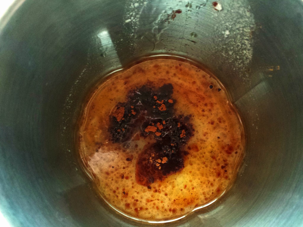 Tea, coconut milk, cinnamon, prepped in cup for immersion blender