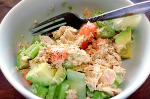 Tuna Salad with paleo mayo, baby carrots, and celery, in a white bowl.